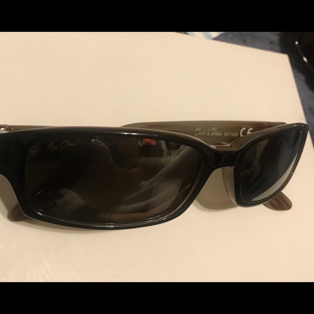 Light brown and black Maui Jim’s.